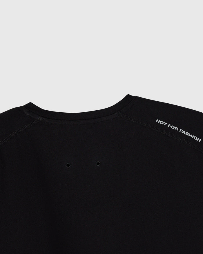 Black crewneck tee with "Not for Fashion" text on back and ventilation eyelets on chest.