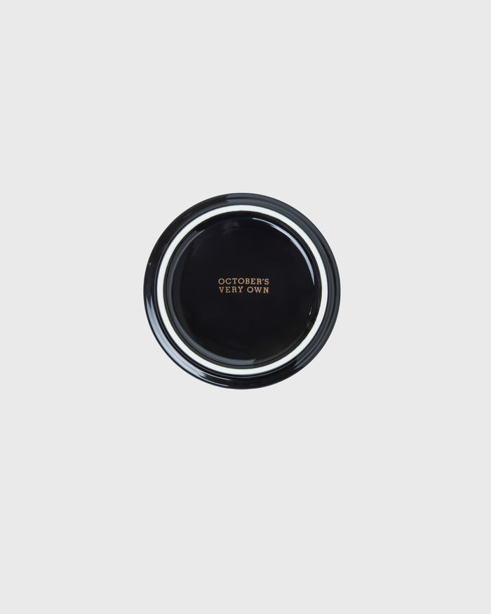 Black round ashtray with gold trim and "October's Very Own" text on center.