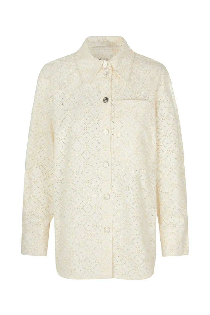 BAUM UND PFERDGARTEN Mahina organic cotton eyelet shirt jacket in cloud dancer color, showing button front and eyelet details.