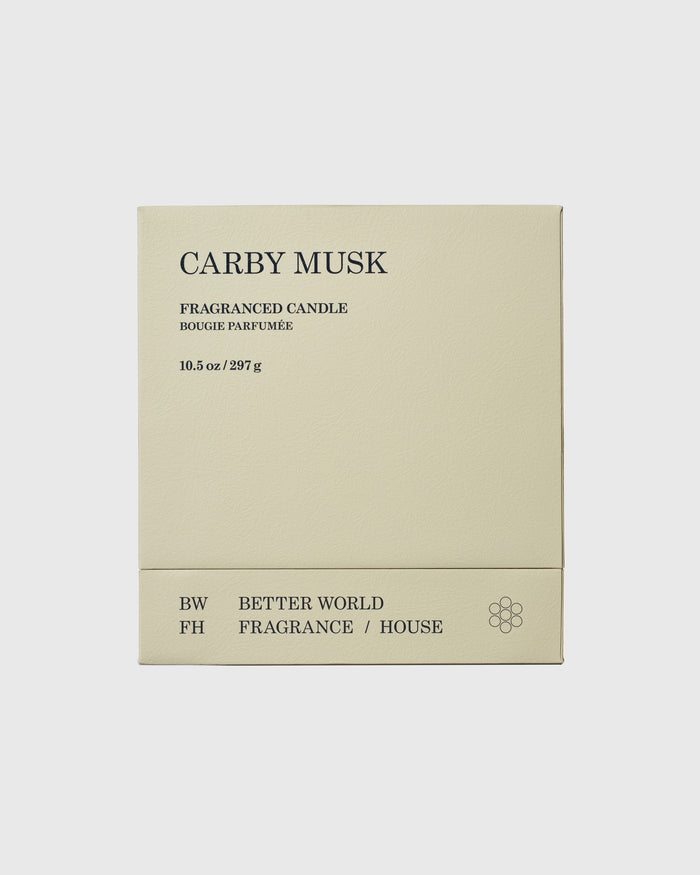 Cream-colored candle box labeled "Carby Musk" by Better World Fragrance House, 10.5 oz, with minimalist text design.