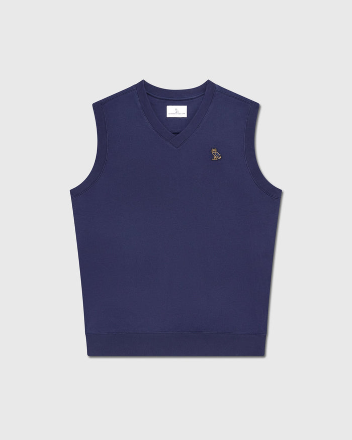 Navy blue sleeveless vest with V-neckline and small embroidered logo on chest.