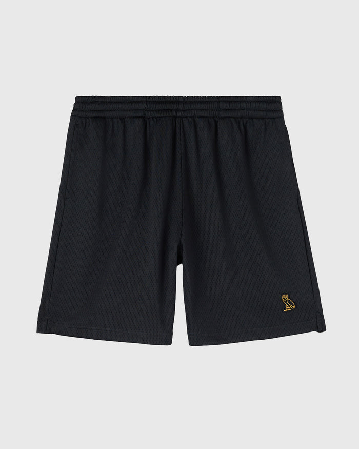 Black mesh shorts with elastic waistband and small gold embroidered logo on right leg.