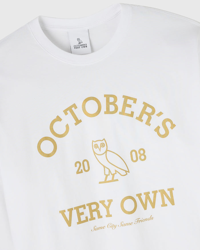 White long-sleeve tee with gold "October's Very Own" text and owl graphic with "2008" dates.