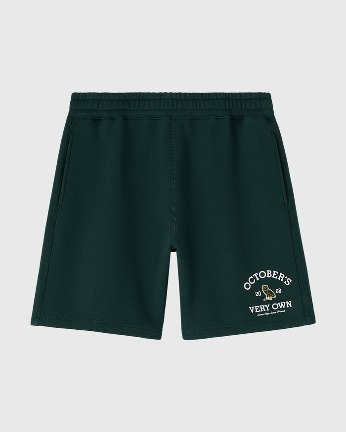 Midnight green shorts with elastic waistband and white "Octobers Very Own" graphic print on right leg.
