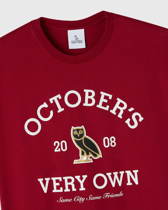 Deep red crewneck tee with white text reading "October's Very Own 2008" and an owl graphic in the center.