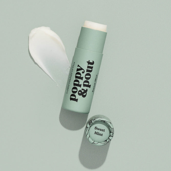 Mint lip balm tube with cap open and creamy balm shown