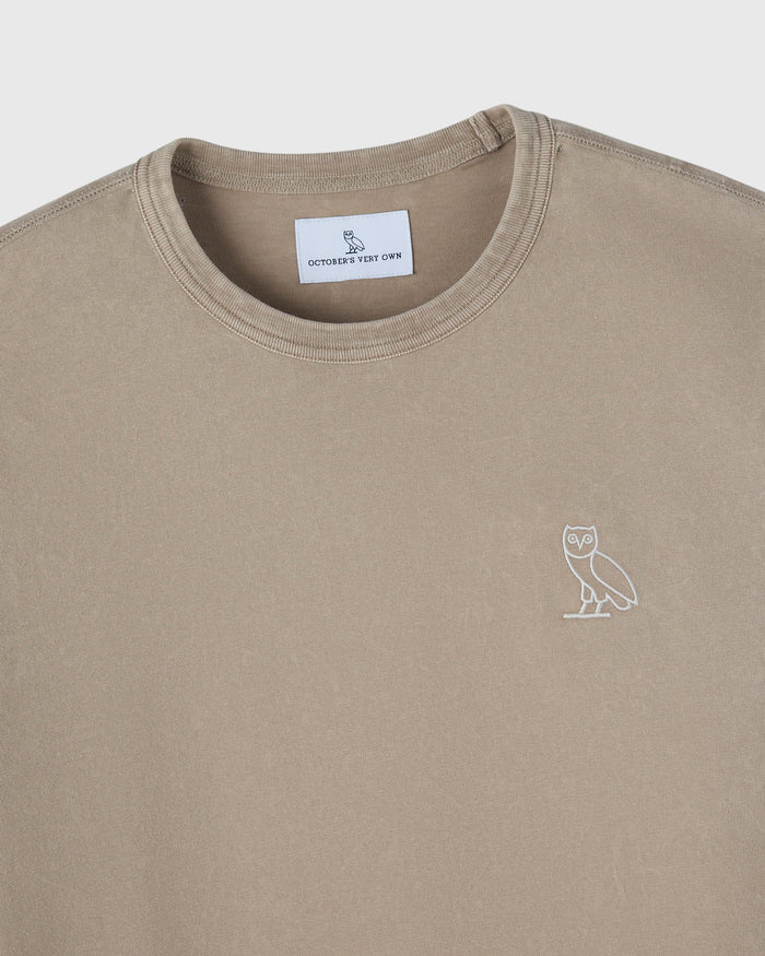 Sandstone long-sleeve tee with crew neckline and small owl embroidery on chest.