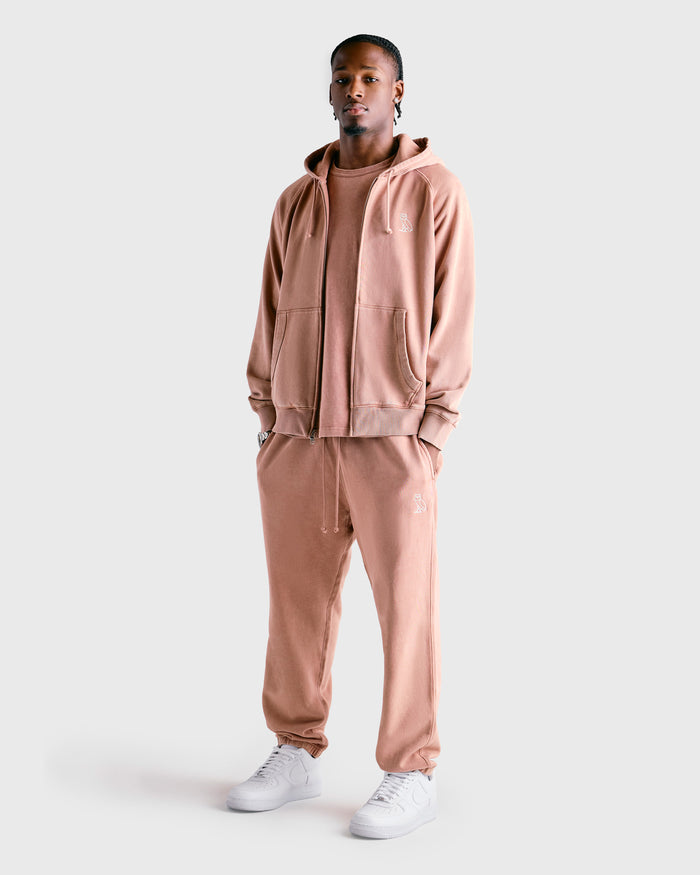 Clay pink Muskoka sweatpant with matching zip-up hoodie, drawstring waist, and side pockets.