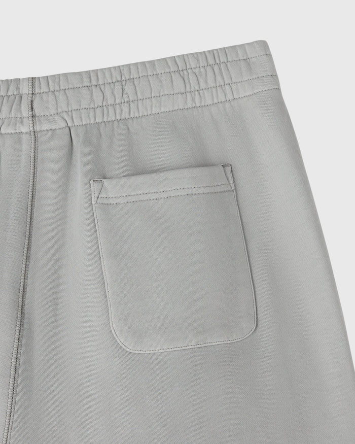 Gray sweatpants with elasticized waistband, side seam, and front patch pocket detail.