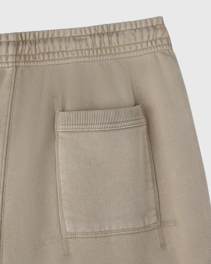 Sandstone sweatpant with elastic waistband and front patch pocket detail.