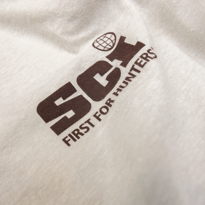 Closeup of SCI logo on left chest of tee