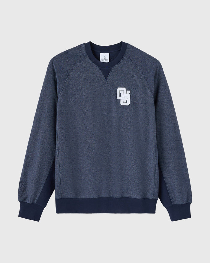Royal navy reverse French terry crewneck sweatshirt with white embroidered logo on chest and navy ribbed cuffs.