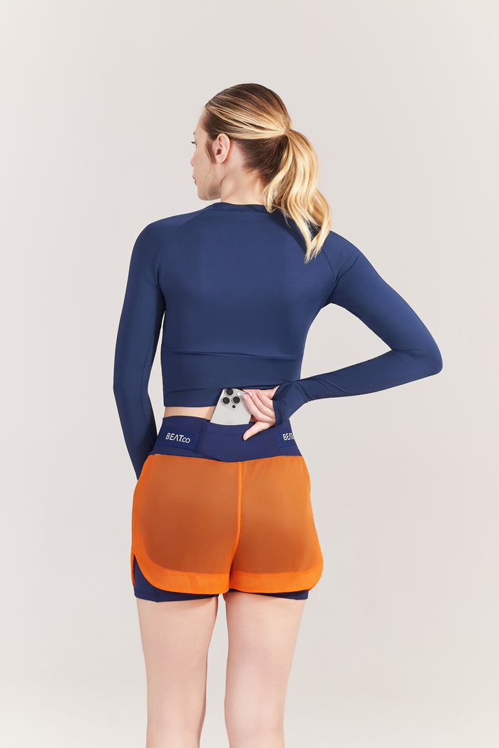 Short Feminino RunPro Marinho com Laranja