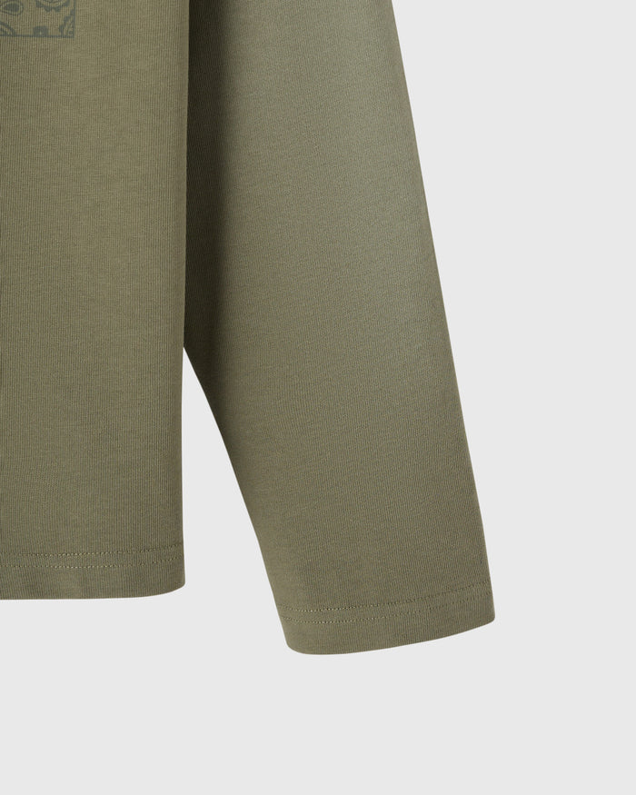 Olive green long-sleeve tee with ribbed texture and banded cuffs.