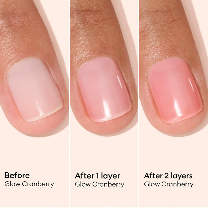 Three close-ups of a fingernail: bare nail (left), nail with one layer of pink polish (middle), and nail with two layers of pink polish (right). Labels indicate Active™ Glow Cranberry by Manucurist, showcasing the transformative effect of this plant-based nail care for naturally tinted, glowing nails.