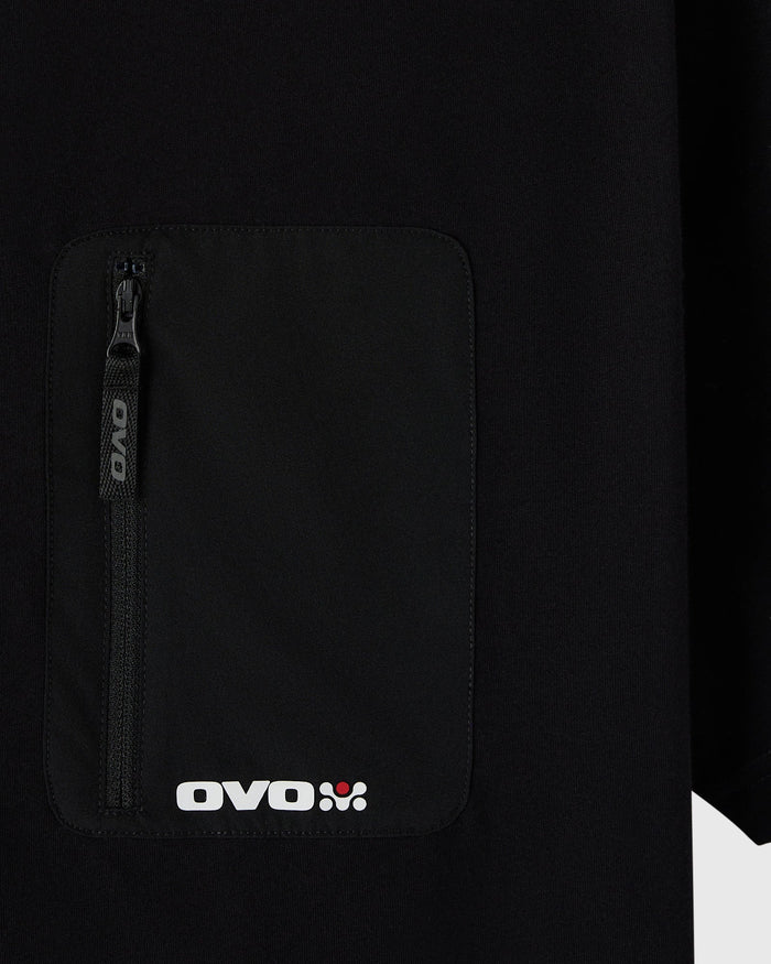 Black t-shirt with front chest pocket featuring zippered compartment and OVO branding.