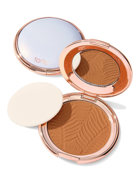 Compact powder with a zebra pattern in an open case on a white background, featuring the tarte logo.