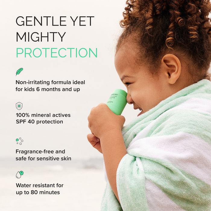 Child holding a green sunscreen product with text about its features