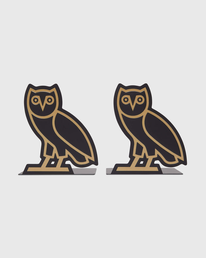 Pair of black and gold owl-shaped bookends with matching bases.