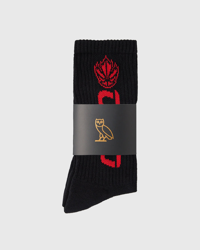 Black ribbed sock with red Canadian maple leaf and basketball design, wrapped in gray band with gold owl logo.