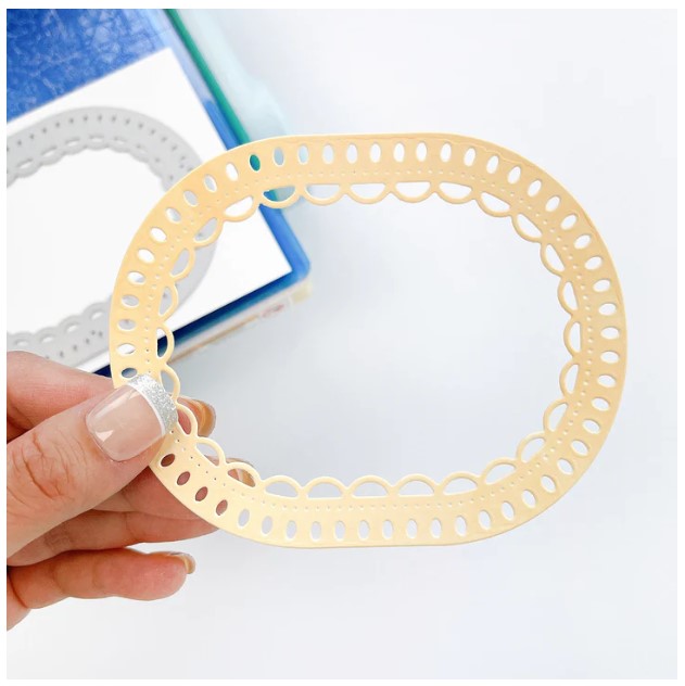 Catherine Pooler - Dies - Fancy Loop. The Fancy Loop Die is a beautiful scalloped frame die. This straight sided oval or "loop" die is a great shape for a standard A2 card front as a feature frame or popped up element. Available at Embellish Away located in Bowmanville Ontario Canada. Example by brand ambassador.