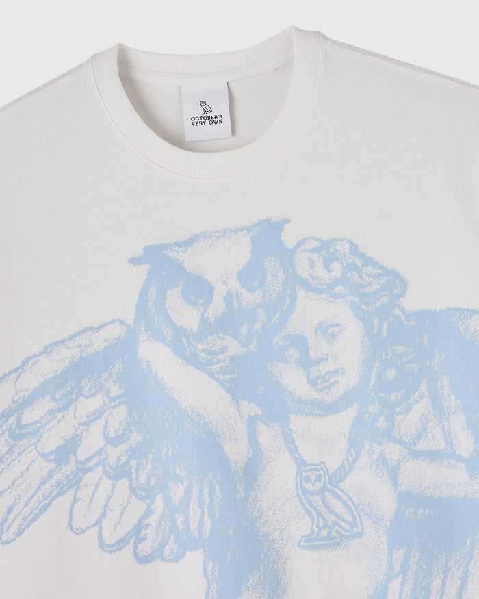 White crew-neck t-shirt with blue cherub print featuring two winged figures on the chest.