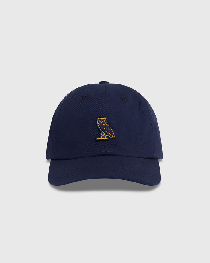 Navy baseball cap with gold owl embroidery on the front.