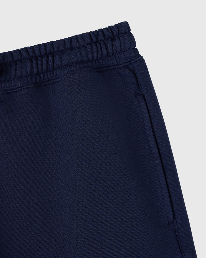 Navy sweatshort with elastic waistband and ribbed trim detail.