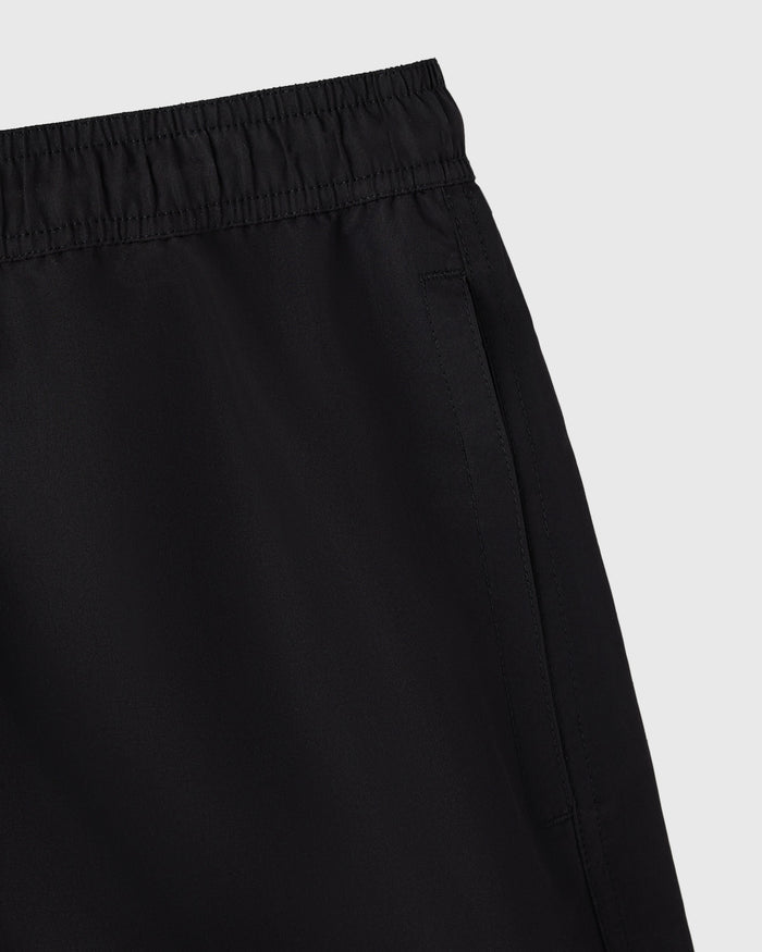 Black swim shorts with elasticated waistband and side seam detail.