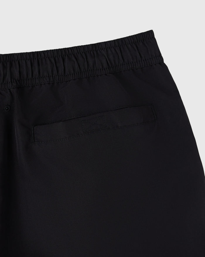 Black swim shorts with elastic waistband and back pocket detail.