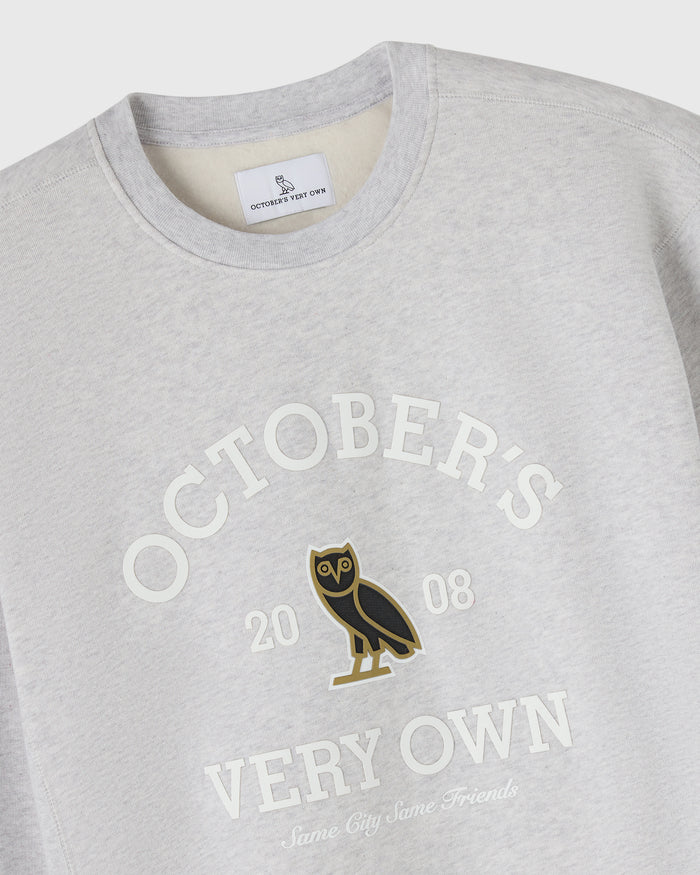 Ash heather grey crewneck sweatshirt with "Octobers Very Own" text and owl graphic on chest.