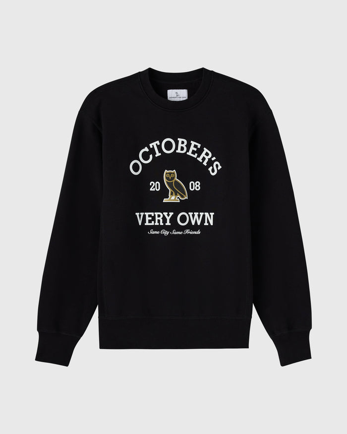 Black crewneck sweatshirt with white "Octobers Very Own" text and gold owl graphic with "2008" below.