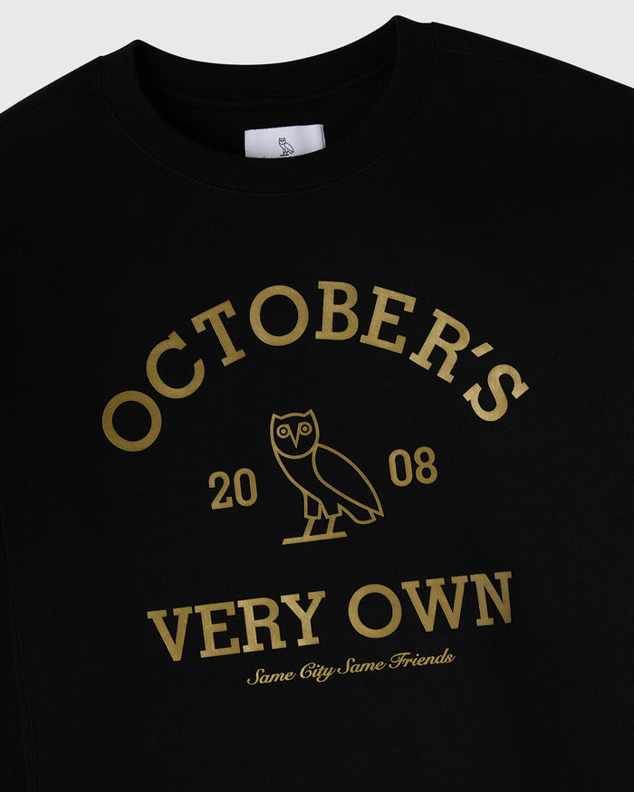 Black crewneck sweatshirt with gold "October's Very Own" text, owl graphic, and "2008" print on chest.