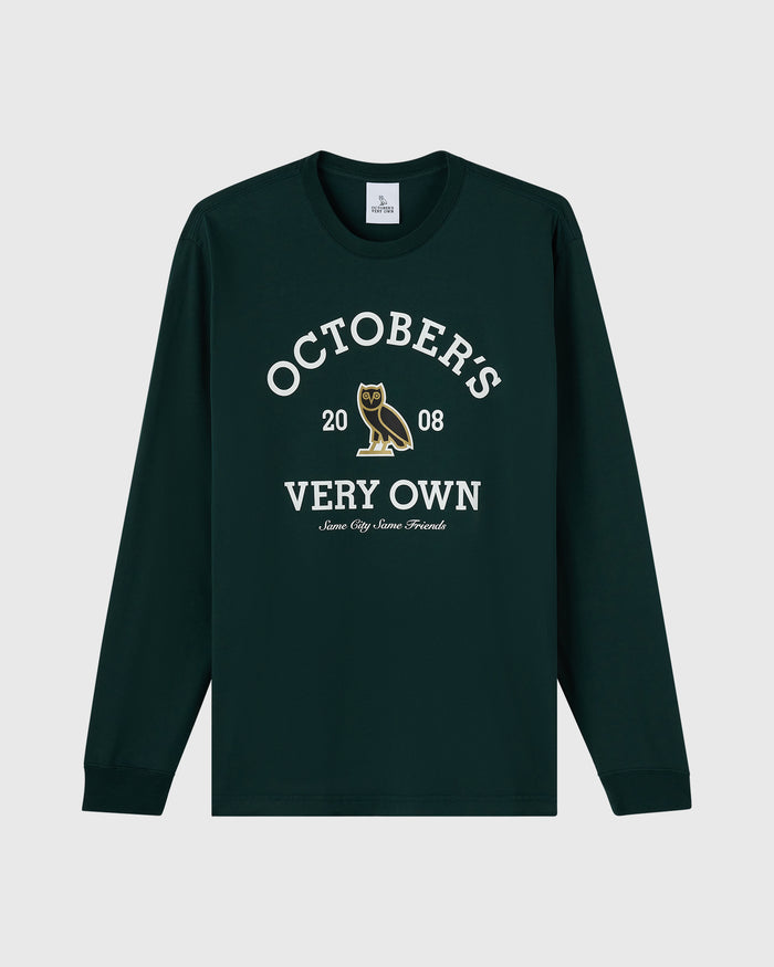 Midnight green long-sleeve tee with "October's Very Own" text and owl graphic on chest.