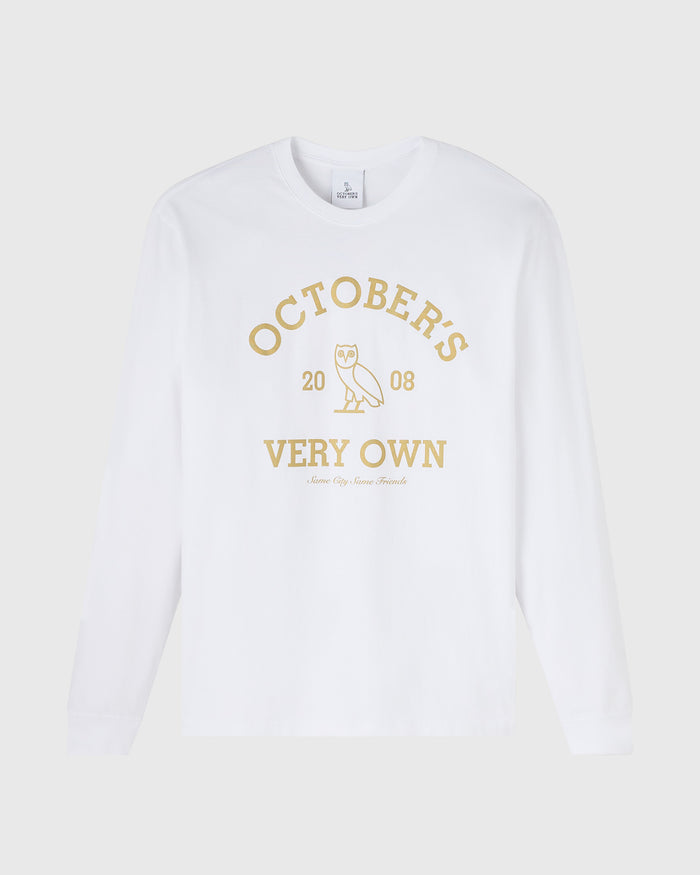 White long-sleeve tee with gold "Octobers Very Own" text and owl graphic centered on chest.