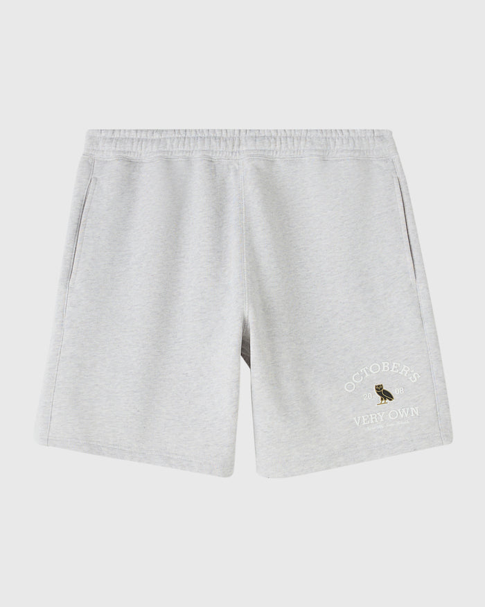 Ash heather grey shorts with elastic waistband and embroidered owl graphic on right leg.