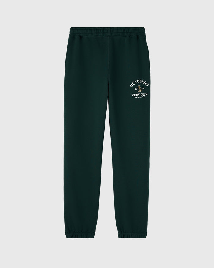 Midnight green sweatpant with white "Octobers Very Own" text graphic on thigh and elastic waistband and cuffs.