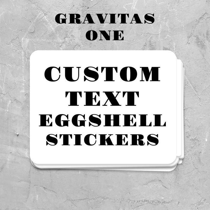 Stack of custom text eggshell stickers on a gray textured background with 'Gravitas One' branding.