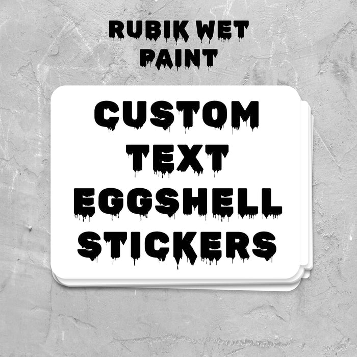Stack of custom text eggshell stickers on a gray textured background with 'Rubik Wet Paint' branding.