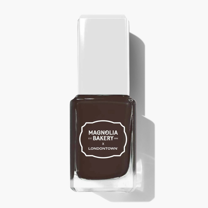 A rectangular bottle of rich chocolate brown nail polish labeled “LONDONTOWN Double Fudge” stands upright against a white background.