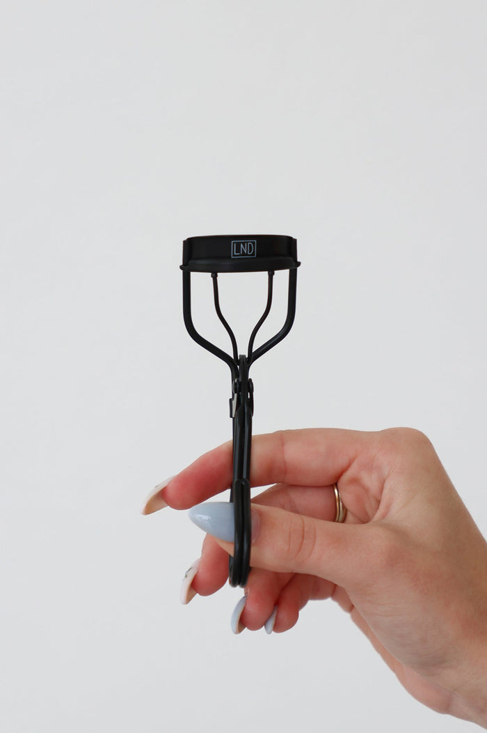 close up of eyelash curler