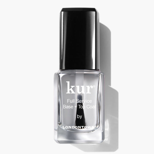 A clear bottle of LONDONTOWN Full Service Base + Top Coat nail polish with a black cap is shown on a white background—this all-in-one formula provides shine and protection in one step.
