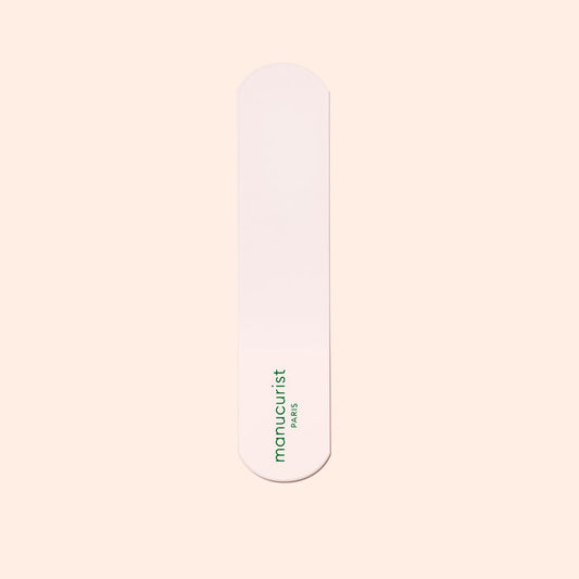 A single pink nail file with rounded ends and the green Manucurist-us logo, ideal for pairing with the Manucurist-us Glass Foot File to exfoliate heels and achieve soft, smooth skin.