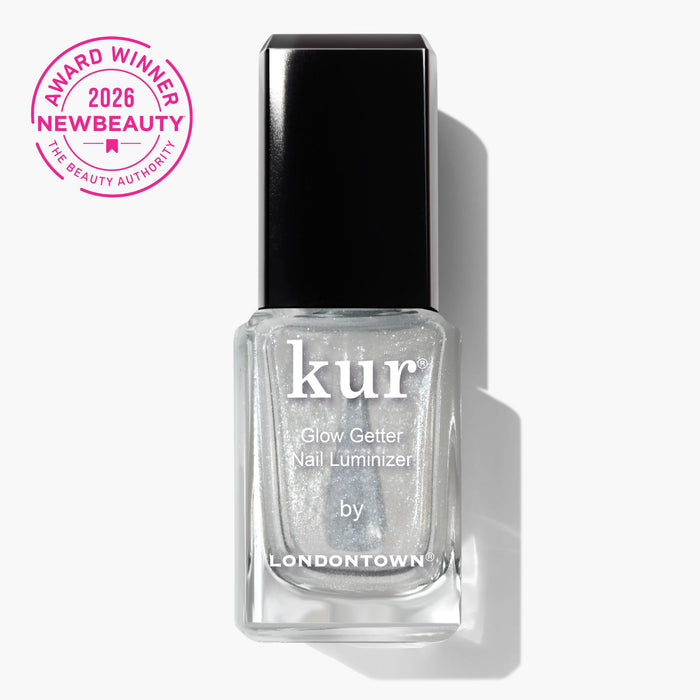 A bottle of LONDONTOWN Glow Getter Nail Luminizer - Diamanté with a "2026 NewBeauty Award Winner" badge in the upper left corner, offering an ethereal finish and powerful nail care.