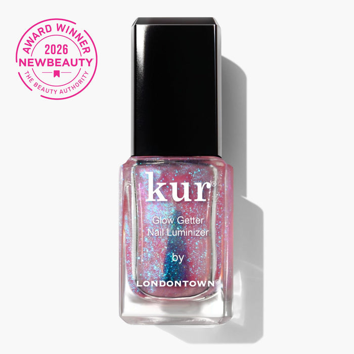 A bottle of LONDONTOWN Glow Getter Nail Luminizer - Prism with pink and blue shimmer offers luminous care and an ethereal finish, shown beside a pink "2026 NewBeauty Award Winner" badge.