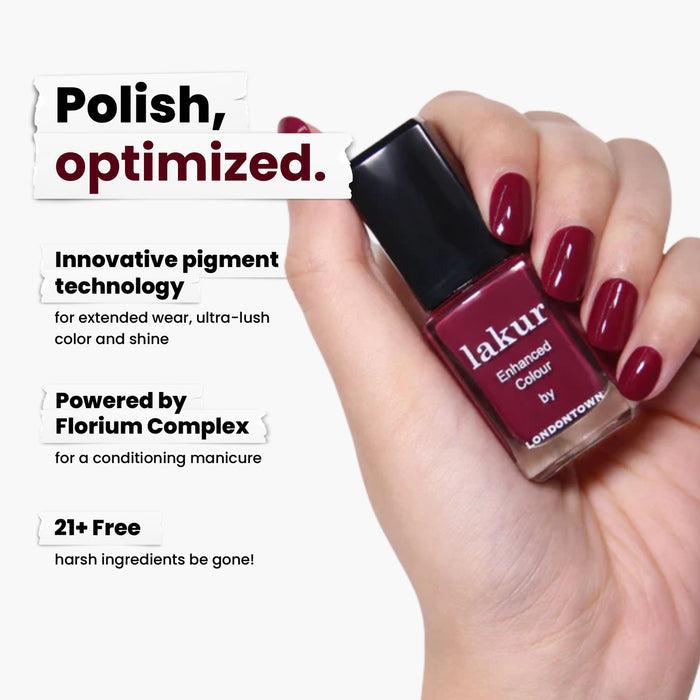 A hand with red nail polish holds a bottle of dark red LONDONTOWN's Guarded Jewel nail polish. The text highlights its pigment technology, Florium Complex, and vegan, cruelty-free formula free from 21+ harsh ingredients.