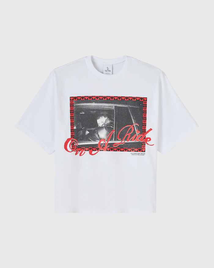 White t-shirt with black and white photo print surrounded by red heart border and red text overlay.