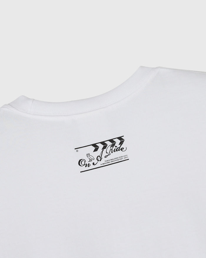 White ribbed t-shirt with black graphic print on chest featuring arrow and text design.