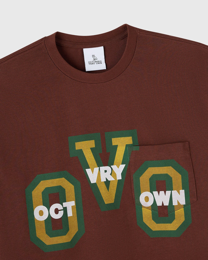 Hickory brown t-shirt with chest pocket and green and yellow "October's Very Own" graphic print.