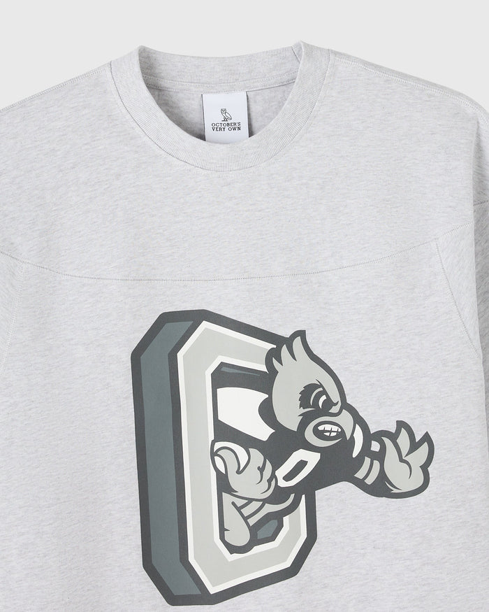 Ash heather grey crewneck tee with large grey and white mascot character graphic on chest.